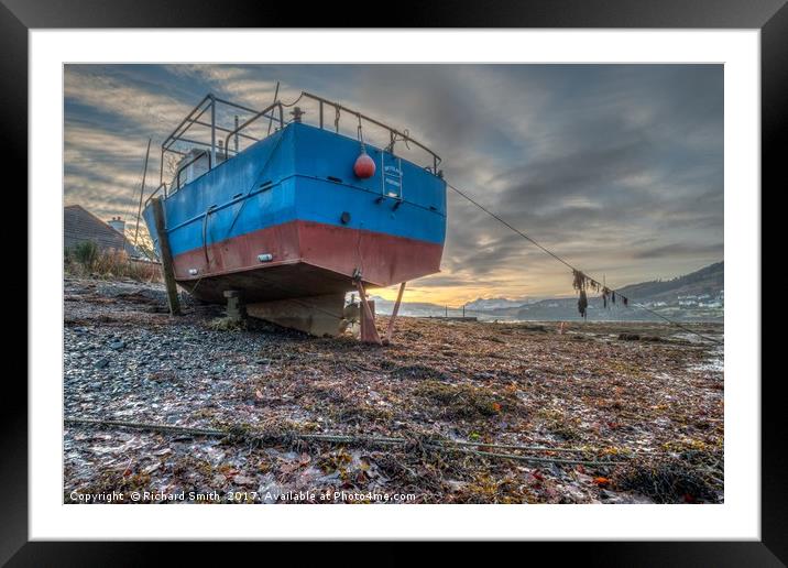 Sunrise colour beyond a beached vessel. #2 Framed Mounted Print by Richard Smith