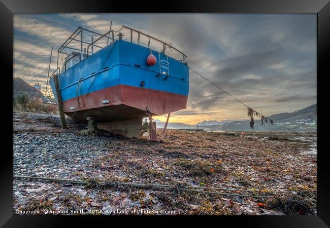 Sunrise colour beyond a beached vessel. #2 Framed Print by Richard Smith