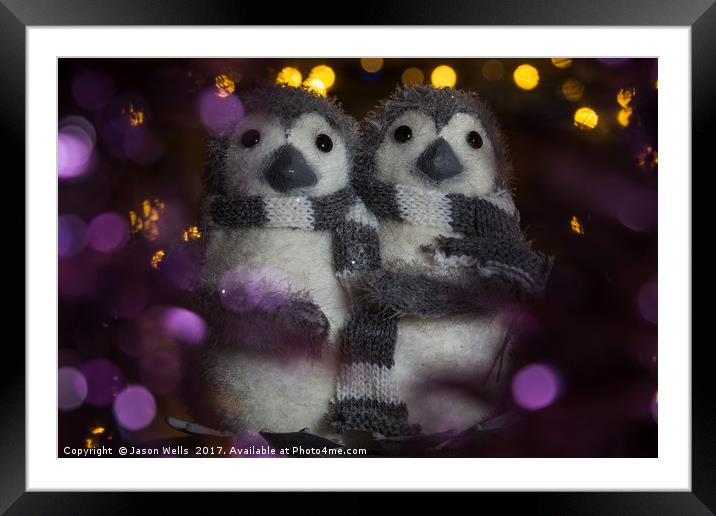 Penguins surrounded in bokeh Framed Mounted Print by Jason Wells