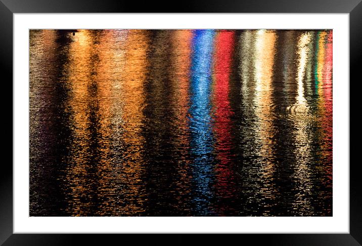 Multicoloured lights refelcted in water  Framed Mounted Print by Chris Warham