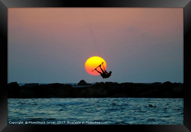 Kite surfing at sunset Framed Print by PhotoStock Israel