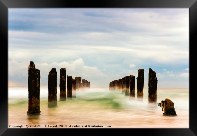 Poles in the sea, long exposure Framed Print by PhotoStock Israel