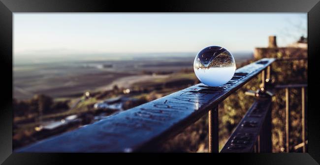 Crystal ball on railing Framed Print by Juan Ramón Ramos Rivero