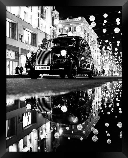 Taxi on Oxford Street Framed Print by Jon Raffoul