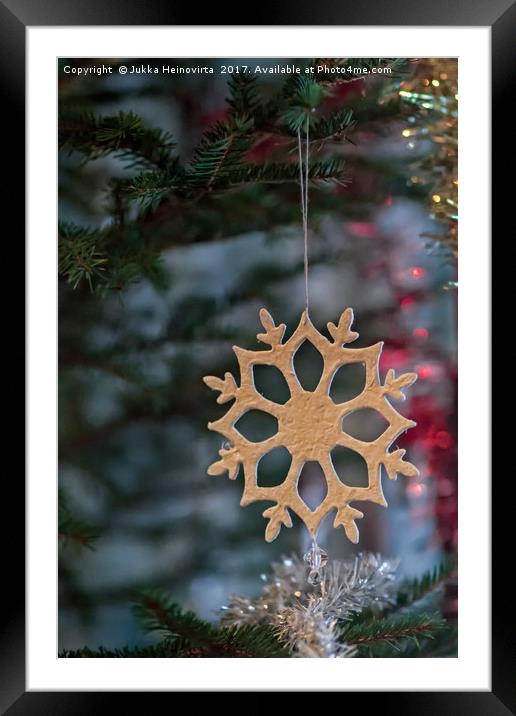 Snowflake On A Christmas Tree Framed Mounted Print by Jukka Heinovirta