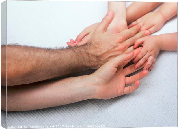 entangled Family hands Canvas Print by PhotoStock Israel