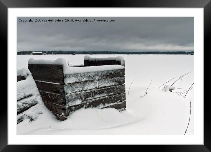 Frozen Crates Covered With Snow Framed Mounted Print by Jukka Heinovirta