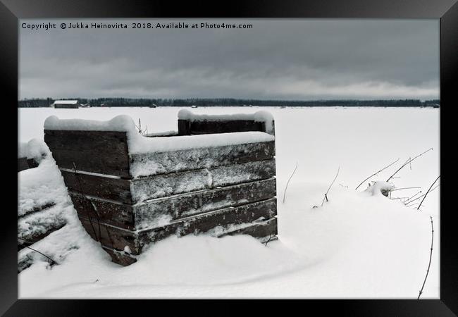 Frozen Crates Covered With Snow Framed Print by Jukka Heinovirta
