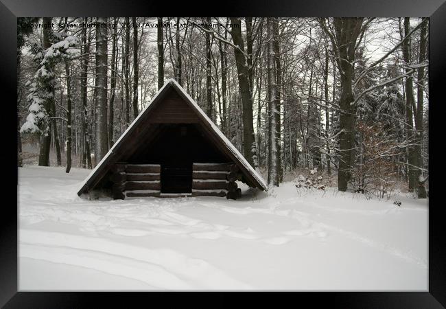 Log Hut In The Snow Framed Print by rawshutterbug 