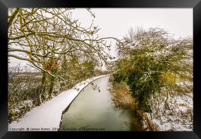 Snowy Canal Path Framed Print by James Aston