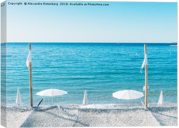 Giant white beach umbrella next to the ocean again Canvas Print by Alexandre Rotenberg