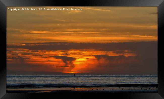 Sunset from the beach... Framed Print by John Wain
