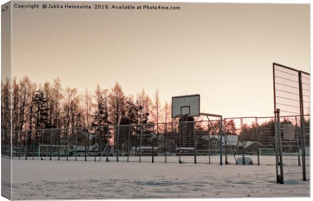 Basketball Field Covered with Snow Canvas Print by Jukka Heinovirta