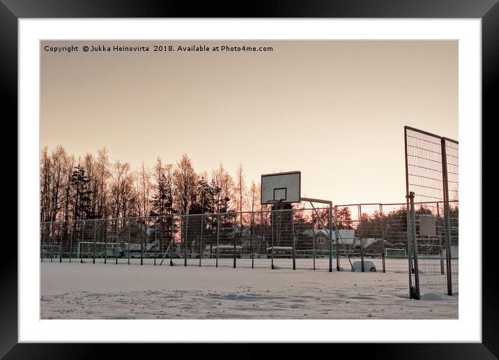 Basketball Field Covered with Snow Framed Mounted Print by Jukka Heinovirta