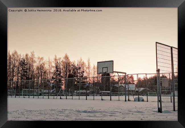 Basketball Field Covered with Snow Framed Print by Jukka Heinovirta