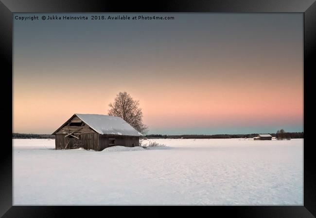 Lonely Barns On The Snowy Fields Framed Print by Jukka Heinovirta