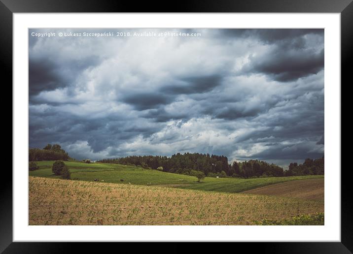 Stormy cloudscape over fields and pasture  Framed Mounted Print by Łukasz Szczepański