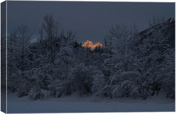 Dawn light hits Bavarian Alps Canvas Print by John Iddles