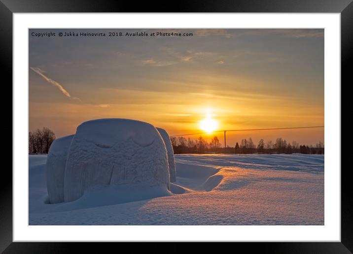 Plastic Wrapped Hay Rolls Covered With Snow Framed Mounted Print by Jukka Heinovirta