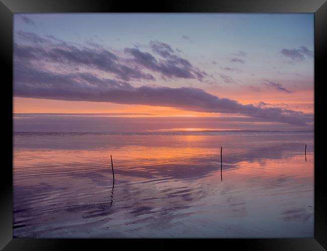 Sunset and the Sticks on Pendine Beach. Framed Print by Colin Allen