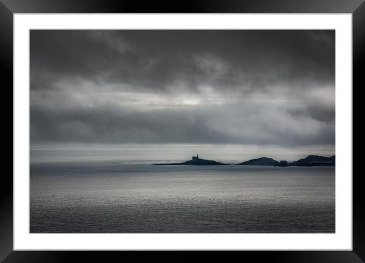 Mumbles lighthouse on a cloudy day. Framed Mounted Print by Bryn Morgan