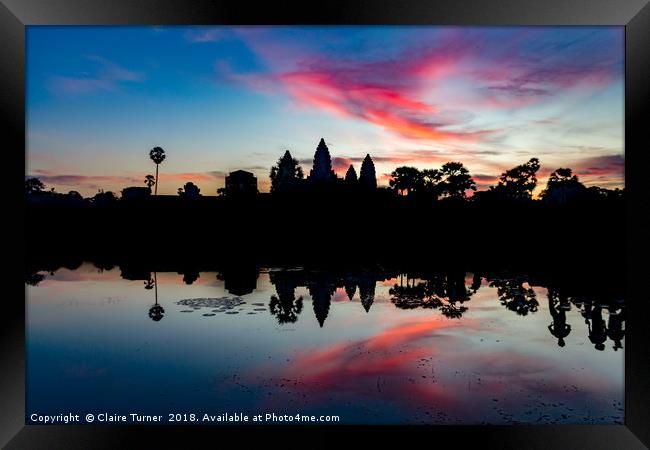Pink sunrise at Angkor Wat Framed Print by Claire Turner