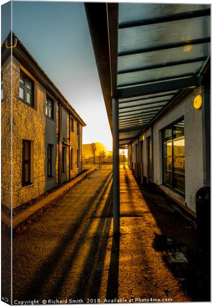 Early morning sunlight streams down a passage way. Canvas Print by Richard Smith