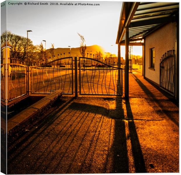 Bright early morning sunlight through gates Canvas Print by Richard Smith