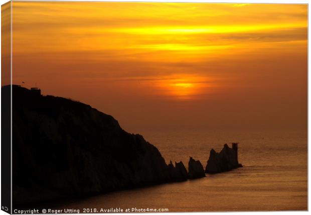 Sunset over the Needles Canvas Print by Roger Utting