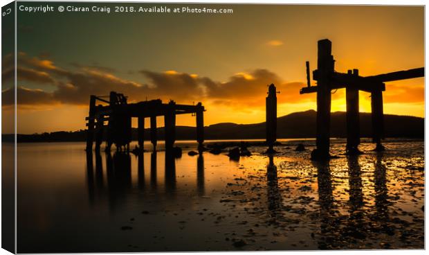 Sunset at the old pier Canvas Print by Ciaran Craig