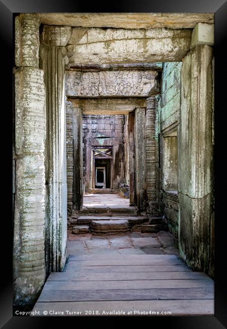 Repeating doorways in ruin Framed Print by Claire Turner