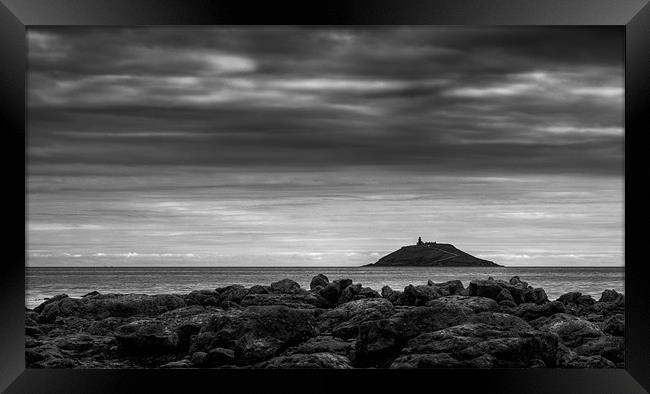 Distant Lighthouse Framed Print by Declan Howard