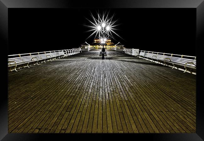 'Pier'ing into the distance Framed Print by Paul Macro