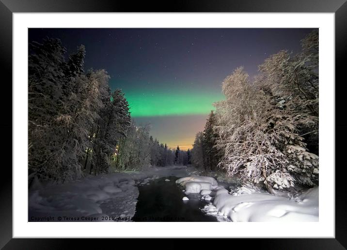 The Aurora Borealis dances over a wintered stream Framed Mounted Print by Teresa Cooper
