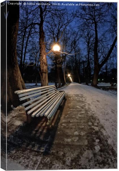 Bench In The Dark Park Canvas Print by Jukka Heinovirta
