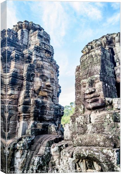 Bayon temple smiling faces Canvas Print by Claire Turner