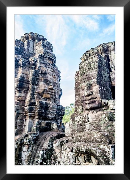Bayon temple smiling faces Framed Mounted Print by Claire Turner