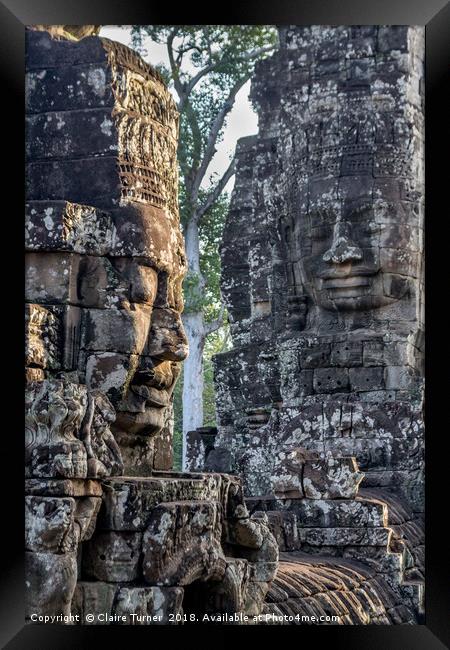 Faces of Bayon Framed Print by Claire Turner