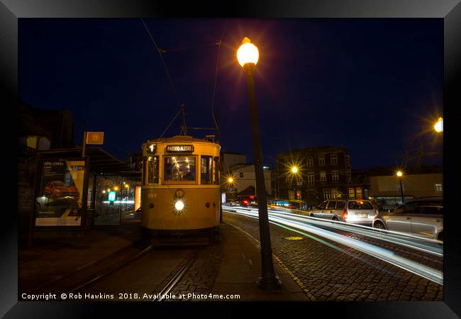 Porto Night Tram  Framed Print by Rob Hawkins