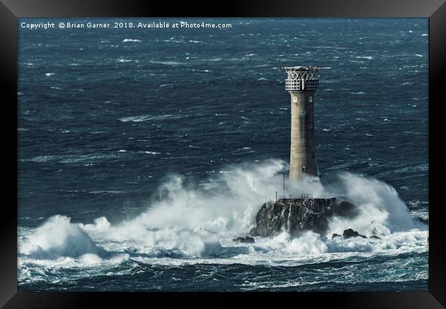 Longships Lighthouse in Rough Sea Framed Print by Brian Garner