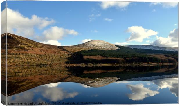 Mirror image on Loch Doon Canvas Print by Judith Lightfoot