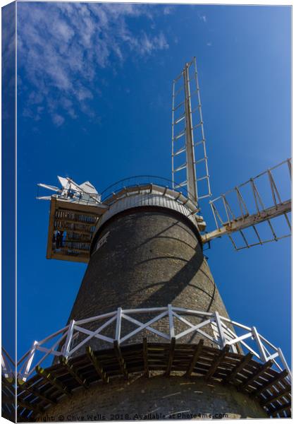 Bircham Windmill under blue Norfolk skies Canvas Print by Clive Wells