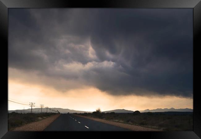 Road trip with stormy sky Framed Print by Sue Hoppe