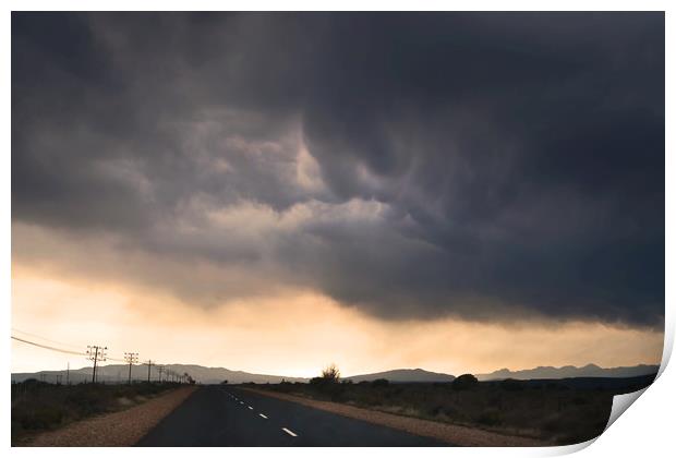 Road trip with stormy sky Print by Sue Hoppe