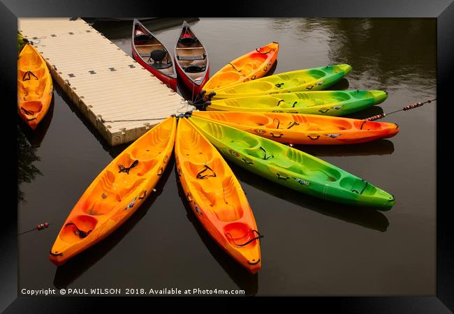 Canoes on the jetty on a French lake Framed Print by PAUL WILSON