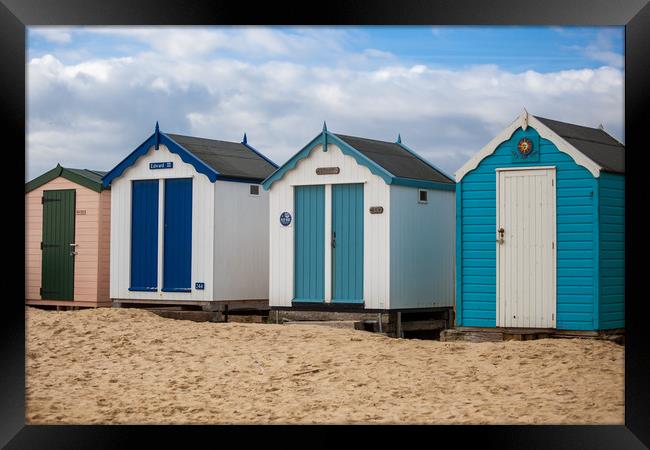 Colourful Seaside Shelters Framed Print by Kevin Snelling