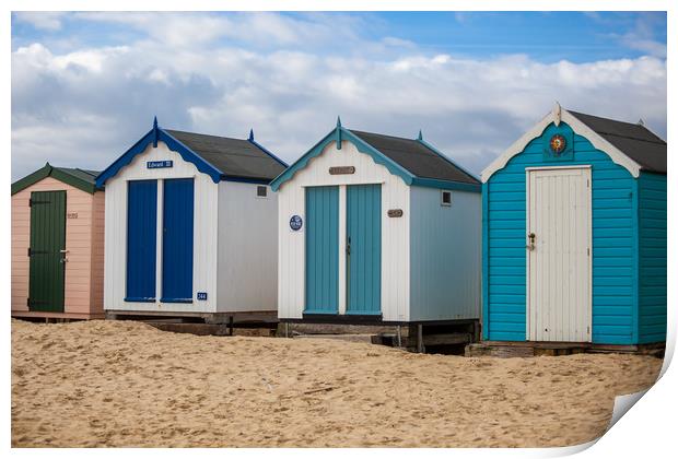 Colourful Seaside Shelters Print by Kevin Snelling