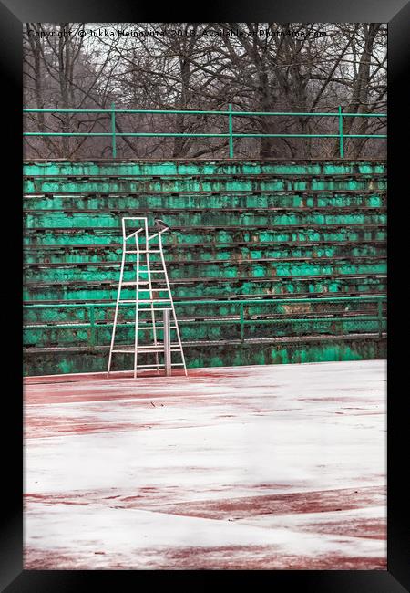 Crow On A Snowy Tennis Court Framed Print by Jukka Heinovirta