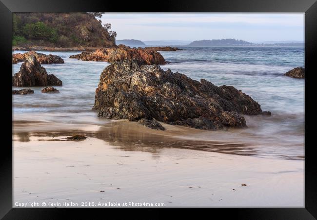 Rocks in the sea Framed Print by Kevin Hellon