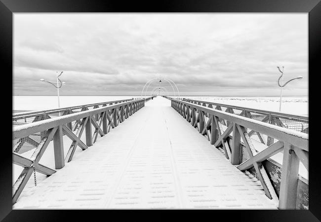 Southport Pier in the Snow Framed Print by Roger Green